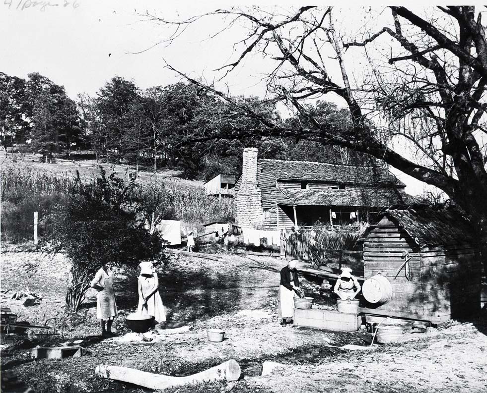 Black-and-white photo of a pre-electricity farm scene