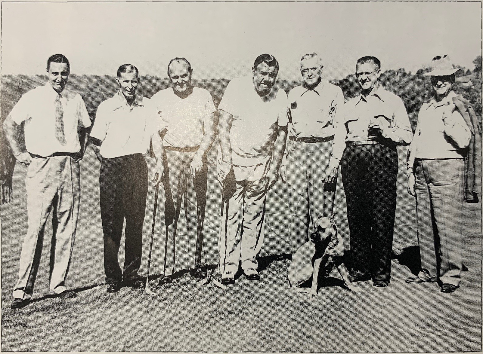 Black-and-white photo of Babe Ruth (center) with a group of other men and a dog, posing for a group photo on a Sussex County golf course. Source: “Sussex County: Images of Our Past Vol. 2,” published by NJ Herald (2009)