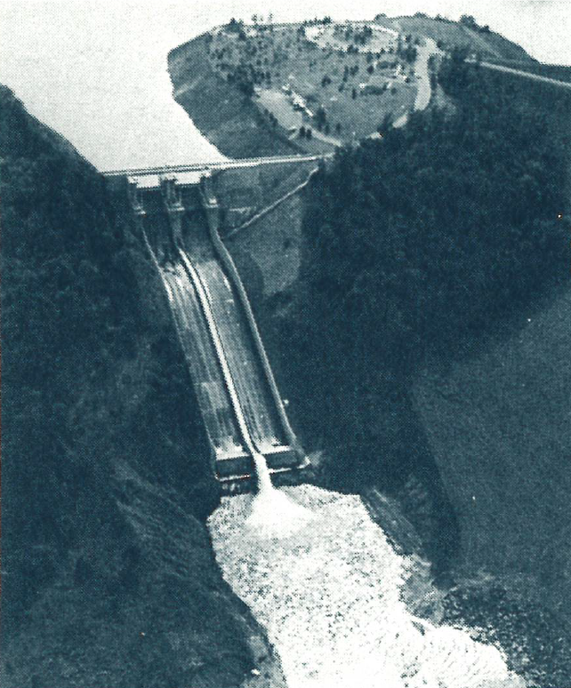 A black-and-white, aerial shot of the dam at the Raystown Hydroelectric Project, which provides hydroelectric energy to Pennsylvania and New Jersey’s rural electric cooperatives through their power supplier Allegheny Electric Cooperative.  Source: “Darkness to Daylight” by Mary Ellen Romeo, published in 1986 by Pennsylvania Rural Electric Association.