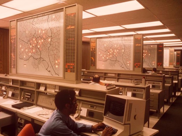 Pictured: System engineers working on the “Millennium Bug” which caused concerns over Y2K. Photo Source: National Geographic, photo by Emory Kristof