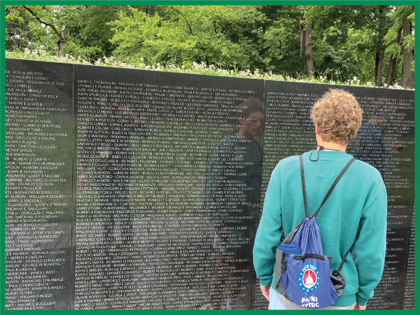 A 2023 NJ Youth Tour students reads names on the memorial wall at the Vietnam War Memorial