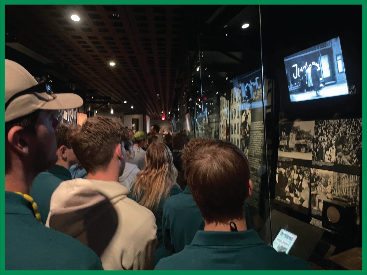 2023 Youth Tour students solemnly read an exhibit in the Holocaust Museum in Washington, D.C.