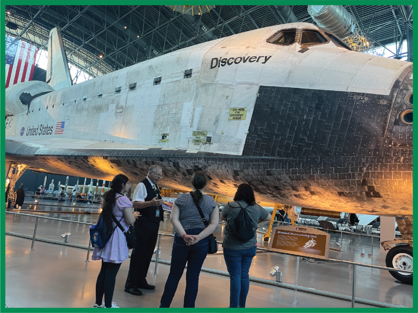 2024 Youth Tour students hear from the tour guide at the Air & Space Museum's Udvar Hazy annex about the Discovery space shuttle