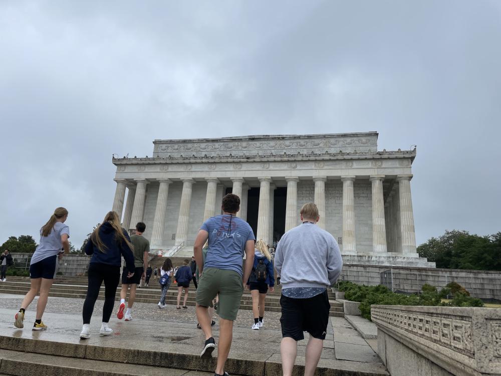2023 Youth Tour students walking up the steps toward the Lincoln Memorial