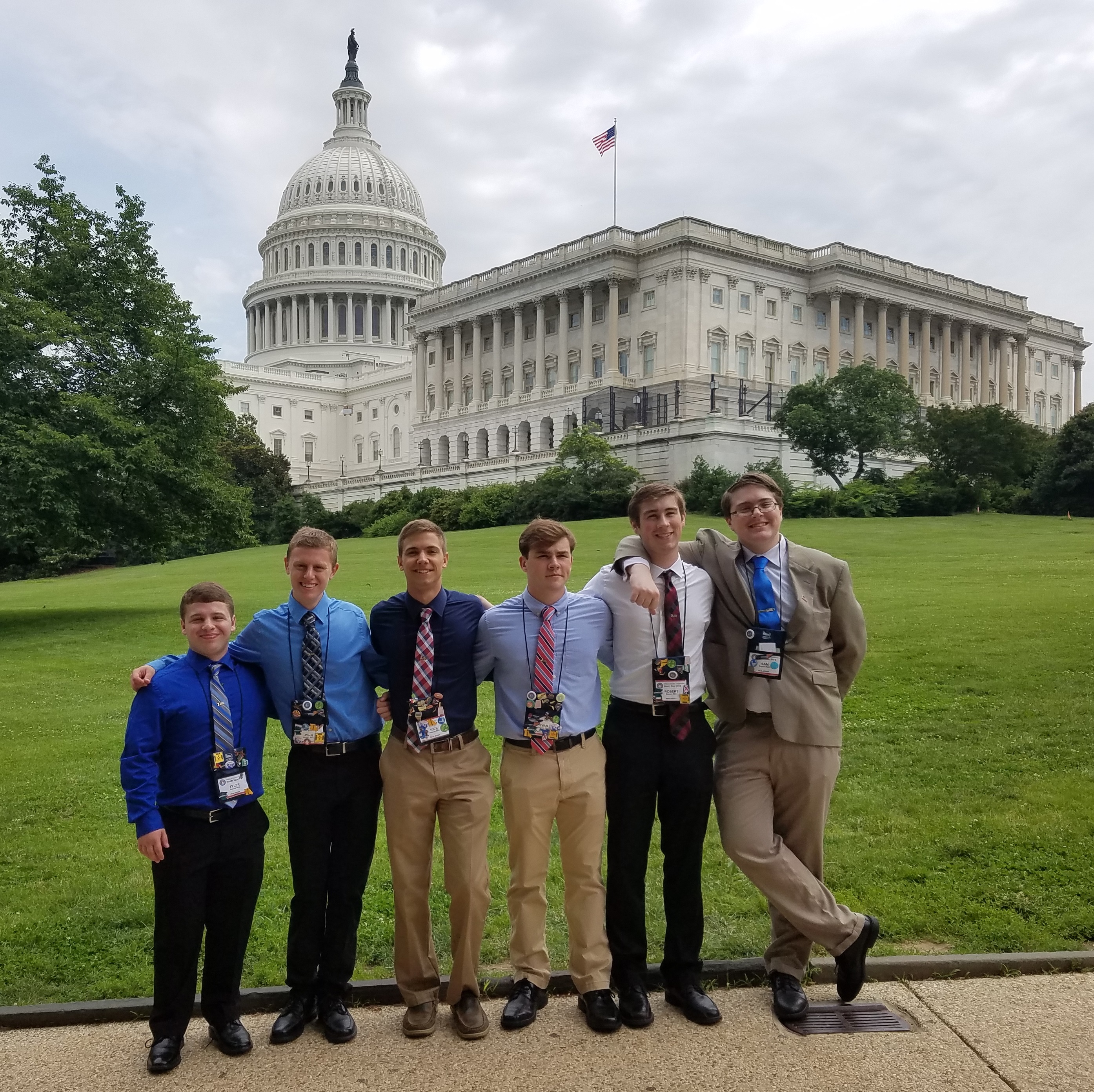 A group of New Jersey students on Youth Tour in 2018 post together in front of the Capitol building