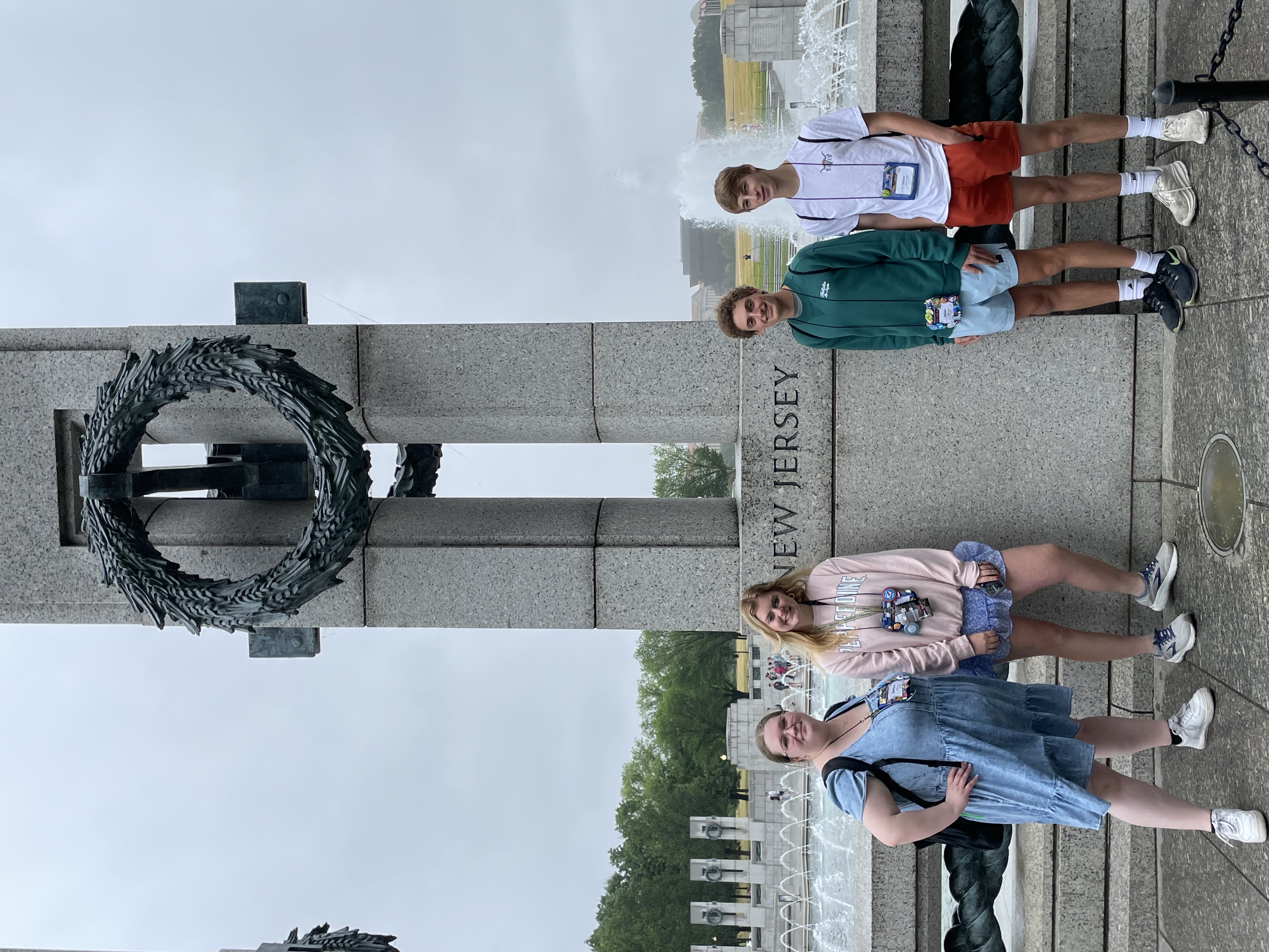 2023 New Jersey Youth Tour students (from left to right: Bethann Juhr, Maddie Kappelmeier, Dylan Barca, and Isaac Schuman) post at the New Jersey monument at the World War II Memorial in Washington, D.C.