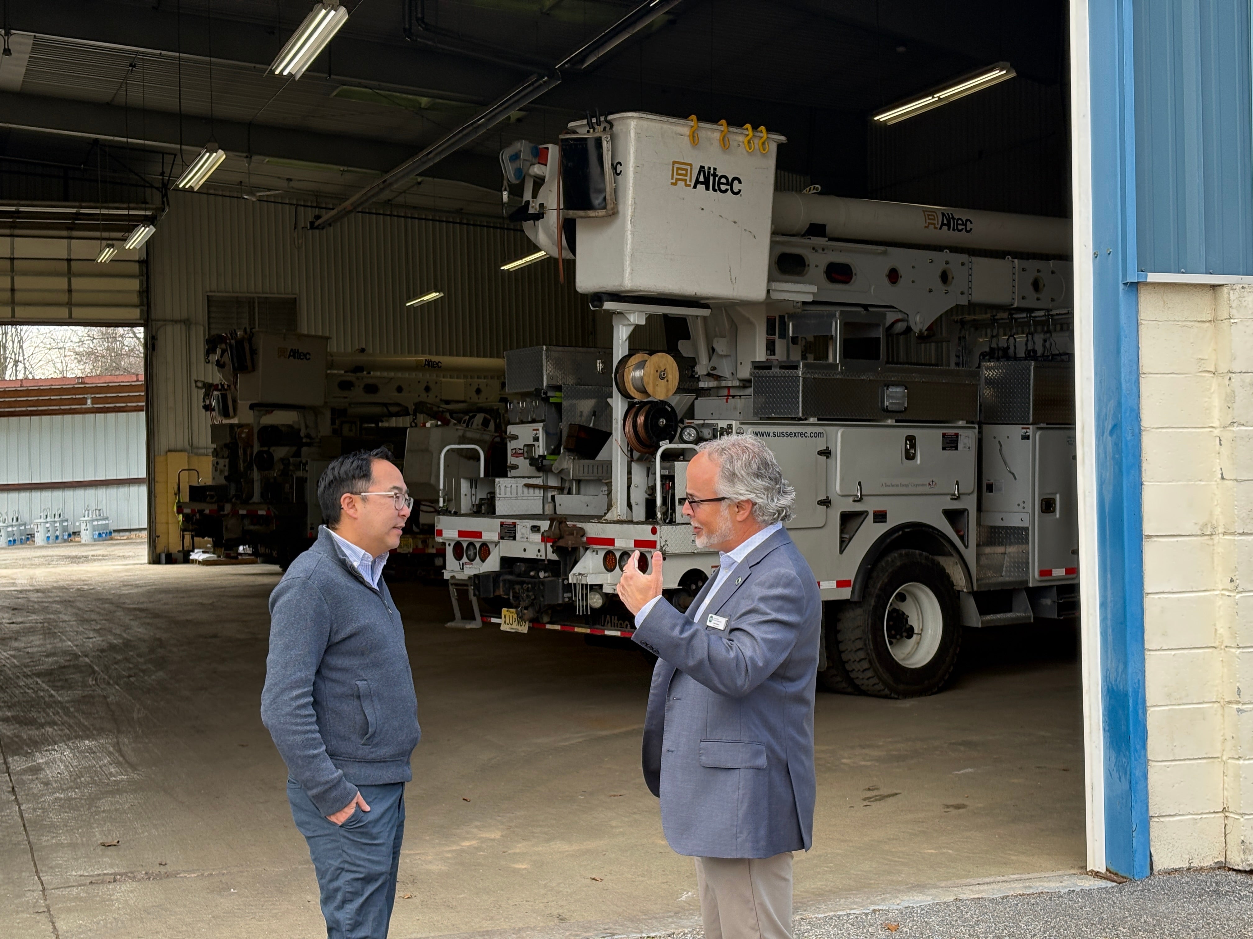Pictured: Sussex REC President & CEO Chris Reese speaks to Senator Andy Kim outside of Sussex REC's garage.