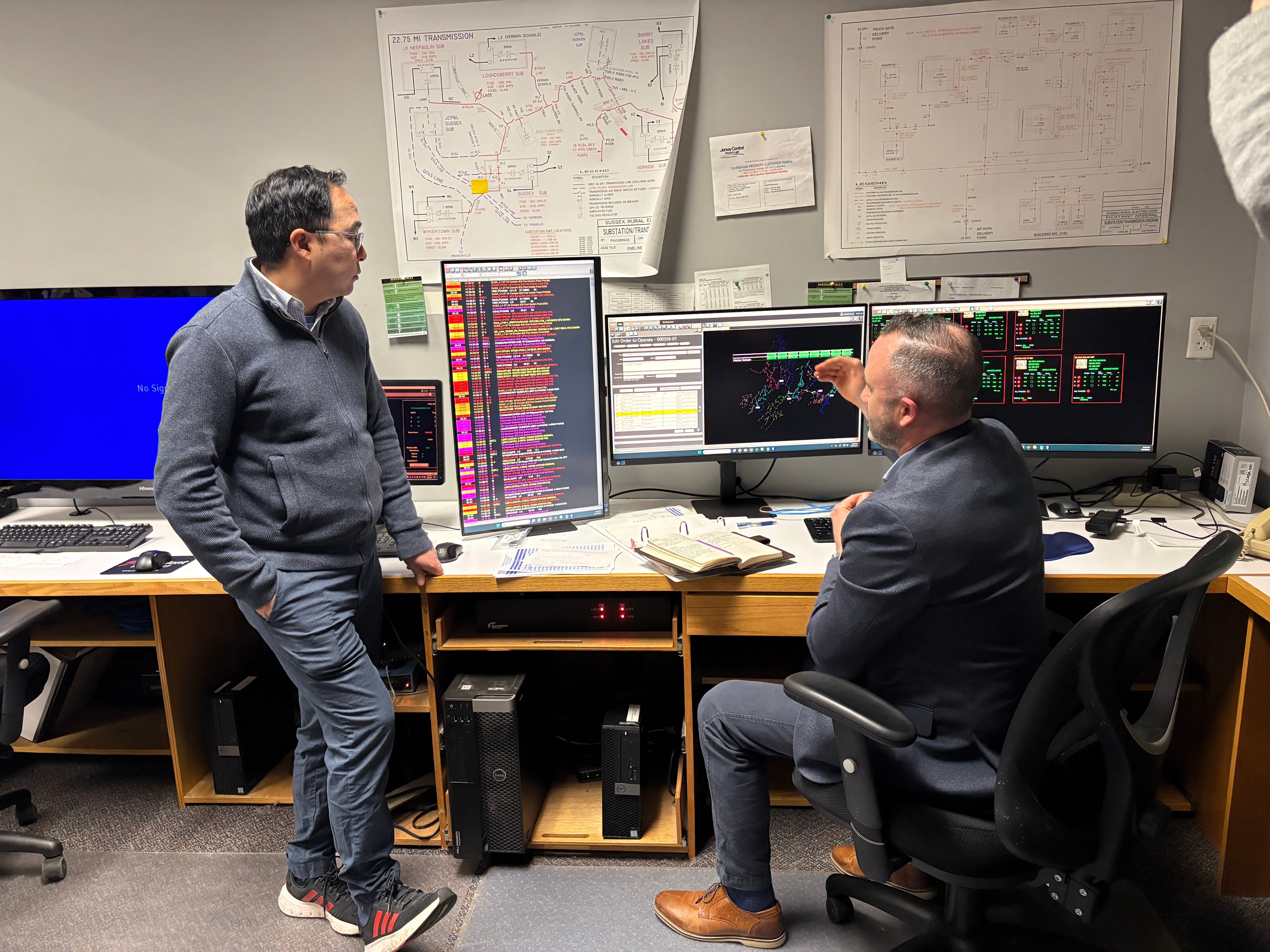Pictured: Sussex REC Director of Engineering & Operations Mike Osborne shows our remote outage monitoring system, SCADA, to Senator Andy Kim and demonstrates our automatic outage restoration software, FLISR.