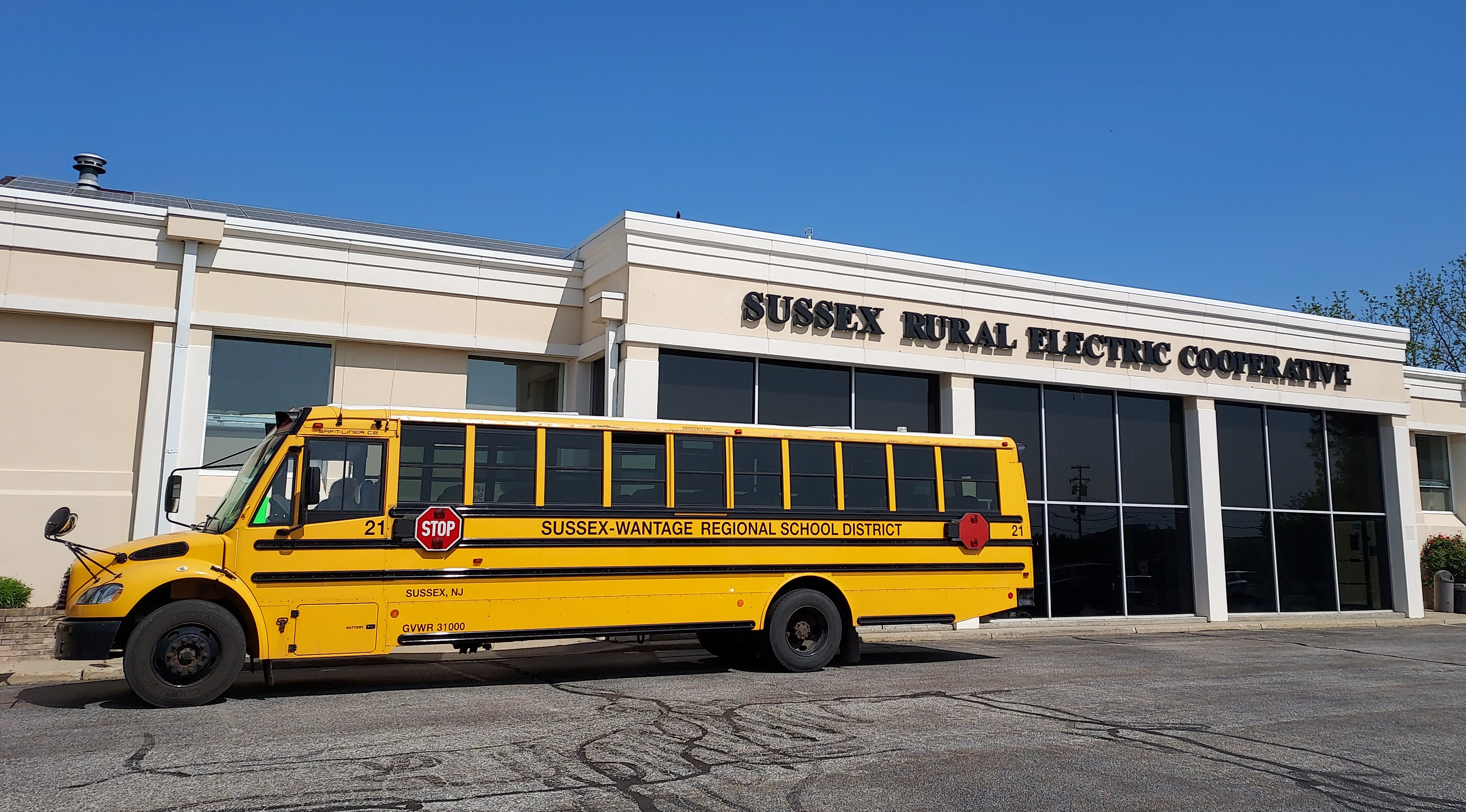 Sussex-Wantage School Bus parked in front of Sussex Rural Electric Cooperative's office for a field trip