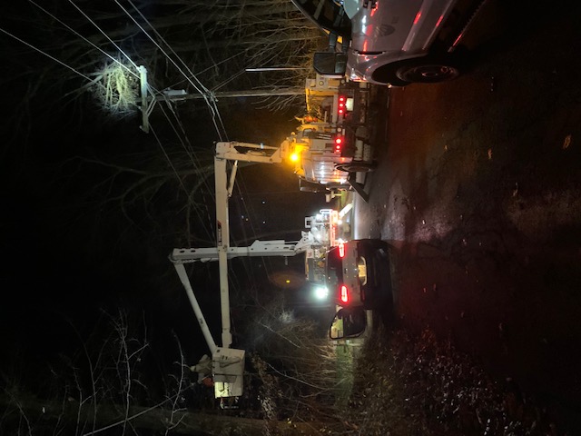 Nighttime photo of SREC crews responding to an outage