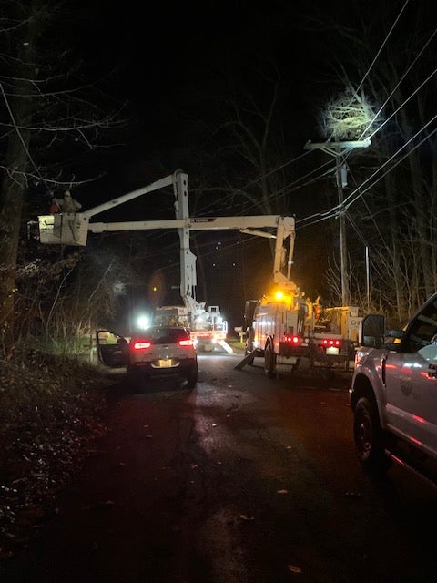 Nighttime photo of SREC crews responding to an outage