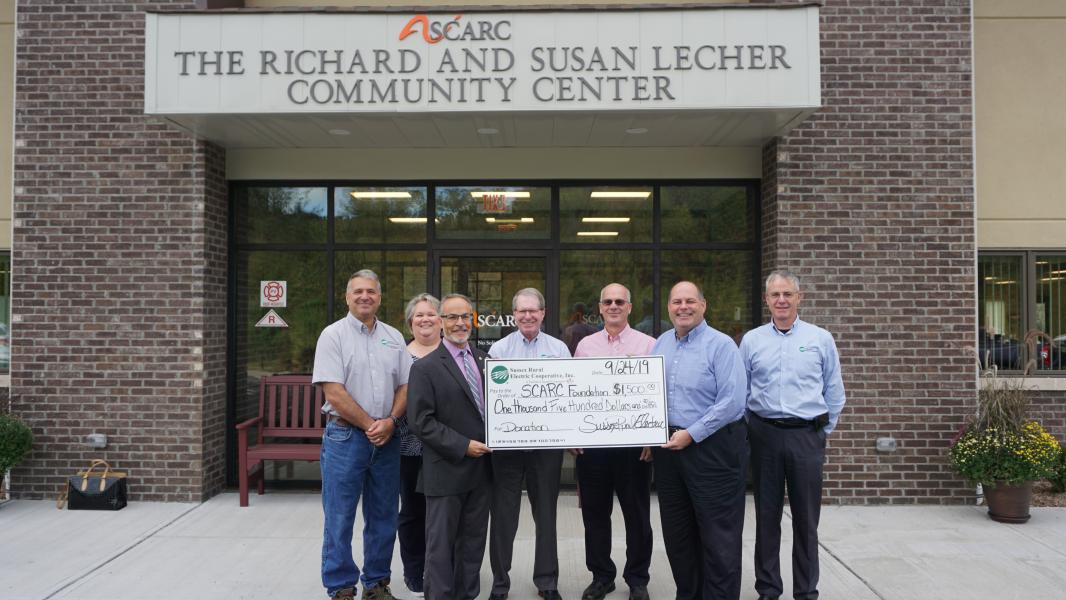 Presenting a donation from our employees' participation in the Employee Directed Giving Program to a representative of SCARC